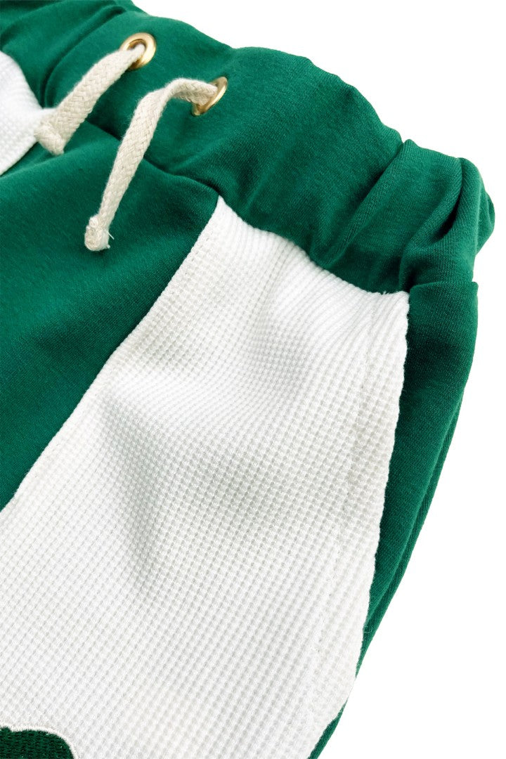 Green pants with knit pockets