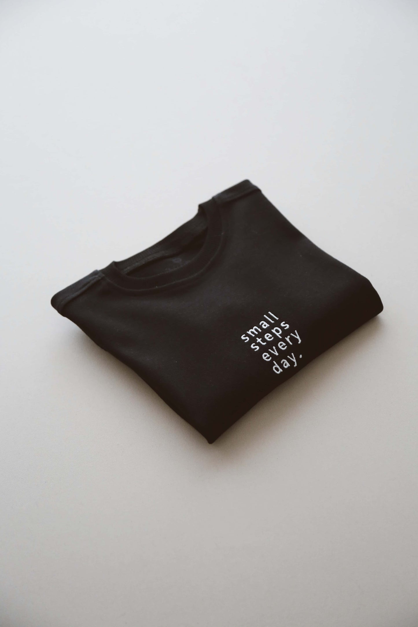 Black tee small steps everyday